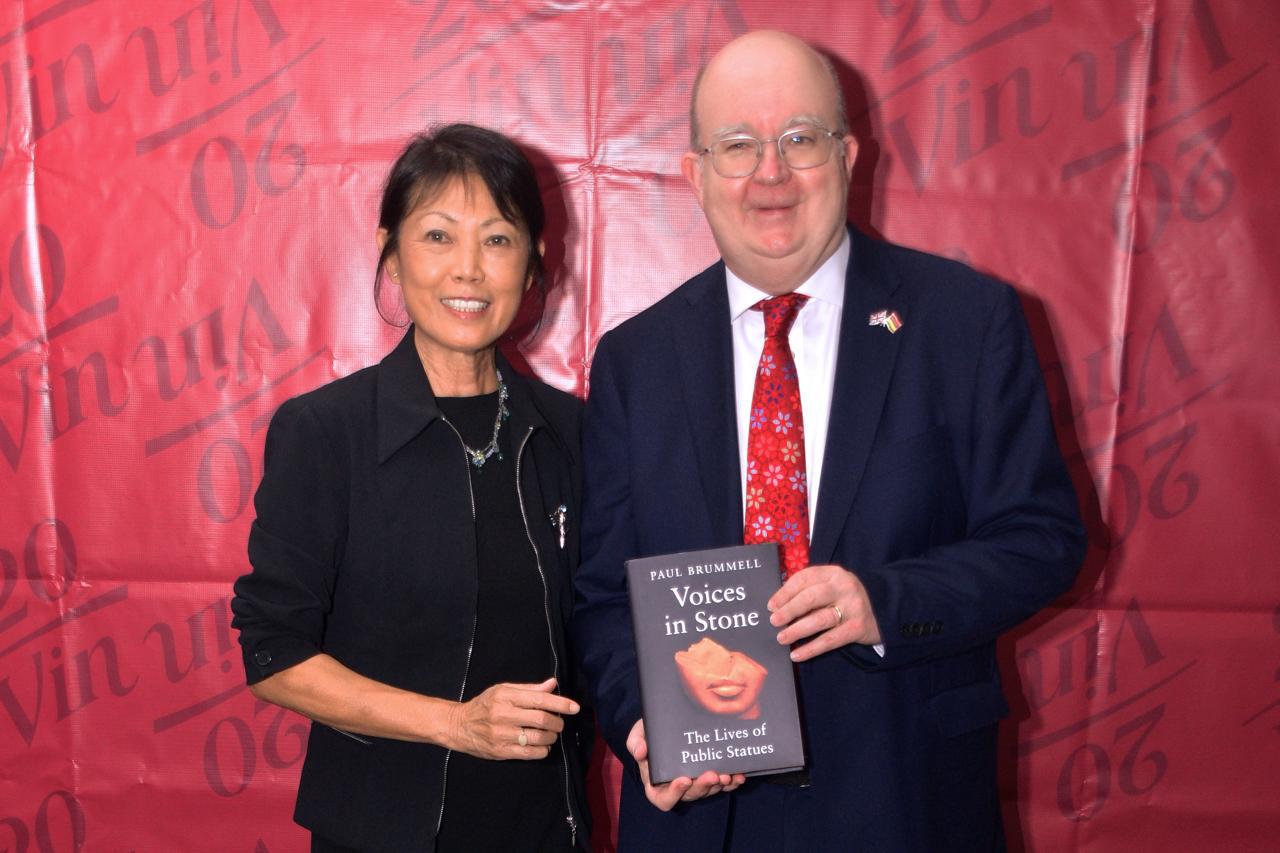 Member and the author posing together with 'Voices in Stone'